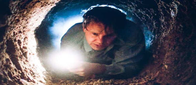 A man dedicates years of his life to scraping a wall with a pocket tool, all for the chance to crawl through a foul sewer line and enjoy a quiet rainstorm.