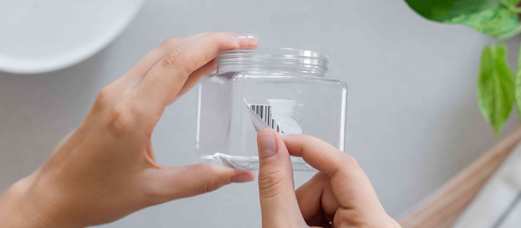 If you are trying to lift a stubborn, sticky price tag off a glass jar, what is your best move?