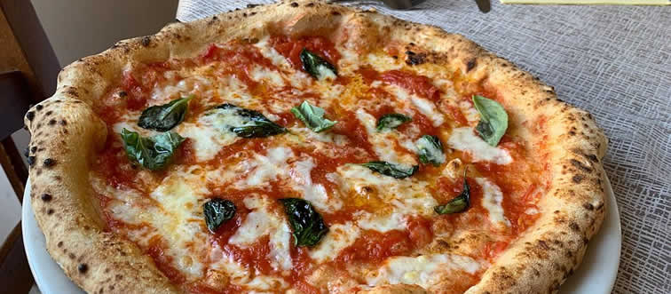 If you picture a perfect wood-fired oven baking a charred, bubbling crust, where does your mind wander to?